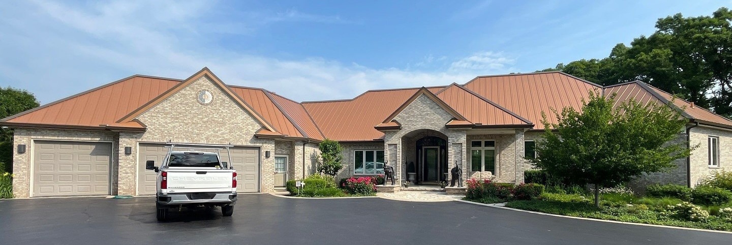 Standing seam metal roof installation on large Aurora IL residence