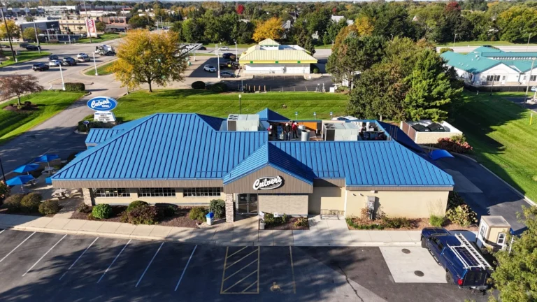 Aerial view of a blue standing seam metal roof installed on a Culver’s restaurant in Oswego, IL